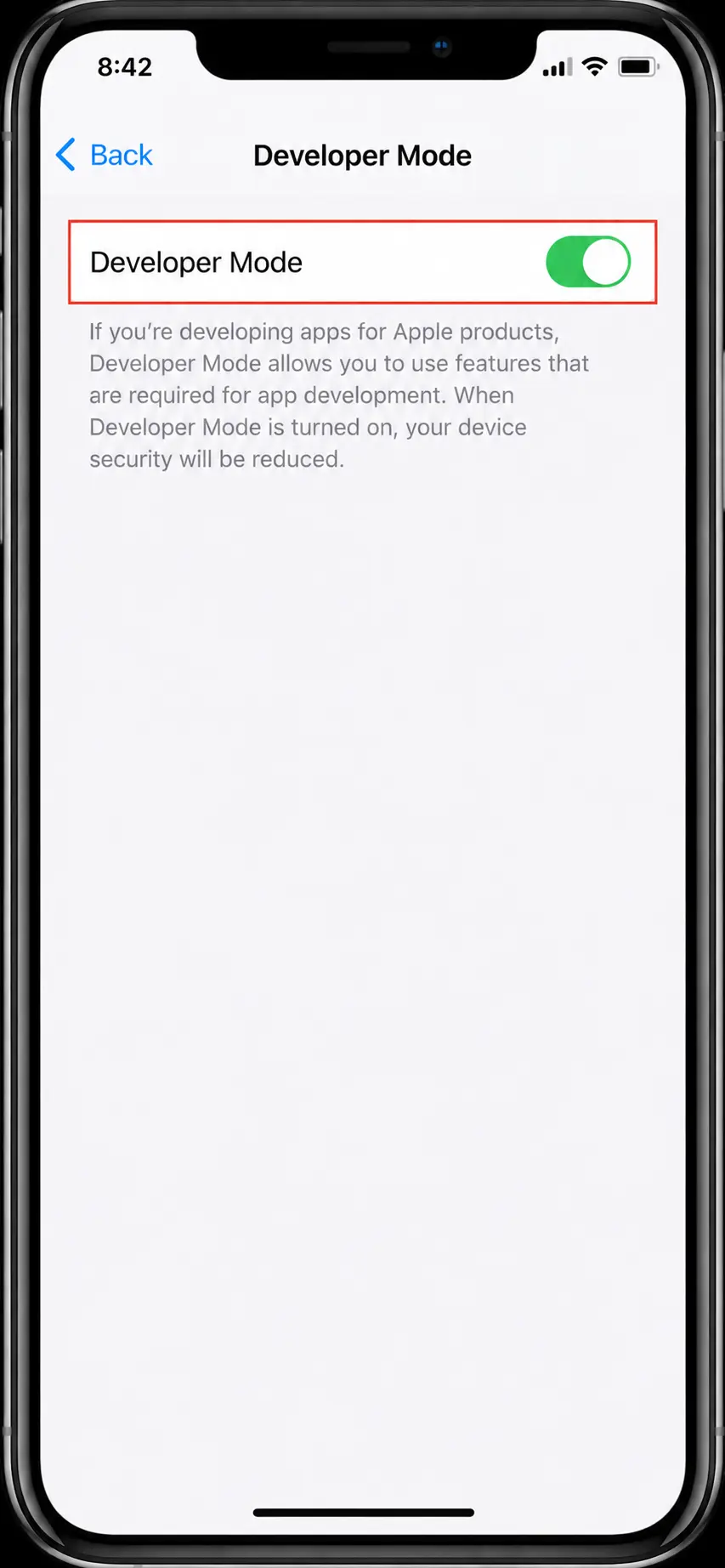 iPhone connected to a computer with a USB cable during the Sideloadly install